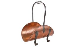 An Arts and Crafts copper and wrought iron log basket signed M Hoste.