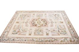 A large French style Aubusson tapestry rug on a cream ground.