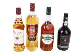 Four bottles of assorted spirits.