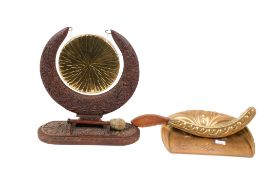 An Anglo-Indian carved dinner gong and a brass crumb pan and brush. Max.