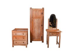 A three piece mid-century limed oak bedroom suite of furniture.
