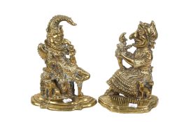 A pair of 19th Century brass door stops modelled as Mr. Punch and Judy.