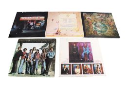A collection of five vintage Elton John vinyl LP records.