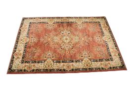 Tabriz Antique style wool rug on terracotta / gold ground.