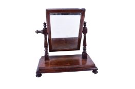 A Victorian mahogany swing dress mirror.