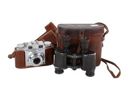 A pair of military binoculars and a camera.