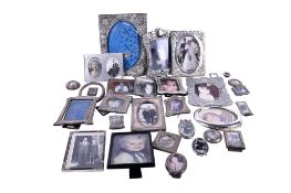 A quantity of Silver plated items to include photograph frames.