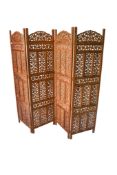 Indian carved and pierced hardwood four-fold screen. Carved with leaf decoration.