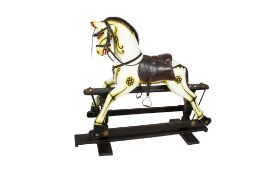 A 20th century lacquered wooden rocking horse.