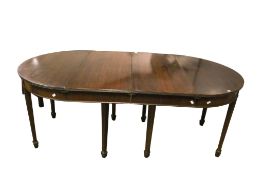 A Georgian style mahogany D end extending dining table.
