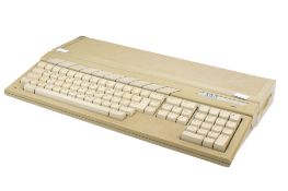 A vintage Atari 520STFM personal computer. S/n A17CJ3010459 K with owner's manual.