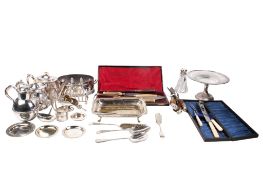 A collection of assorted silverplated items. Including carving sets, tea pots and a toast rack, etc.