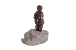 A bronze replica of the 'Venus of Willendorf' sculpture.