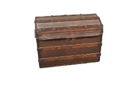 A vintage canvas and wood bound dome top travelling trunk.