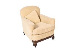 A first quarter of the 20th century reupholstered armchair. Raised on an oak base with casters.