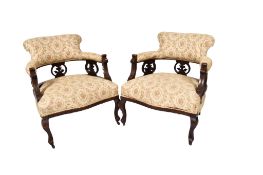 A pair of late 19th early 20th century mahogany tub armchairs