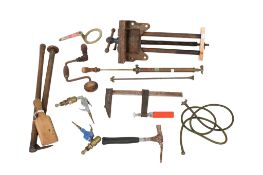 A collection of assorted vintage tools. Including a hosepipe and record bench vice no.