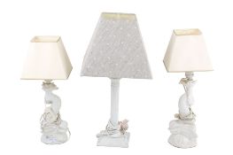 Three modern white table lamps. Including a pair of ceramic dolphins. Max.