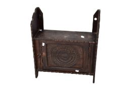 A rustic antique stained pine hanging wall cupboard.