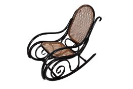 A Thonet style mid-century bentwood rocking chair. With cane work back (af) and seat.