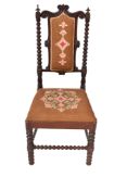 A mahogany bobbin turned chair with embroidered seat and back.