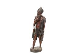 carved hardwood figure of an African hunter