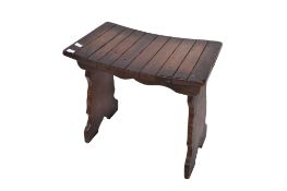 An early 20th century oak stool. Label for Webber Furniture.