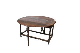 An 18th century oak drop leaf table.