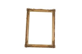 A large gilt moulded and carved wood picture frame.