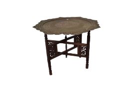 Early 20th century Benares, Anglo-Indian pierced brass tray and folding wooden stand.