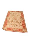 A French Aubusson style tapestry rug on a cream ground.