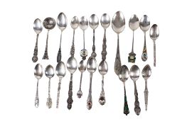 A collection of white metal teaspoons.