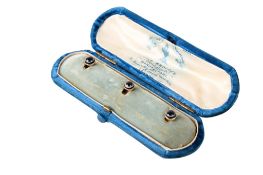 A set of three 15ct gold (tested) dress studs.