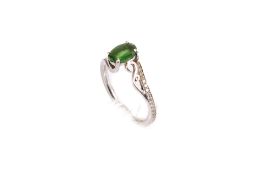 A platinum and tsavorite ring.