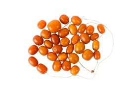 A string of vintage amber beads. Of graduated form, largest bead L15mm, combined weight 62.5g.