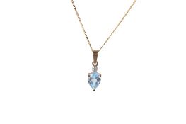 A topaz and diamond pendant and attendant chain.