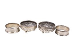 A pair of silver bonbon dishes and a pair of silver napkin rings.
