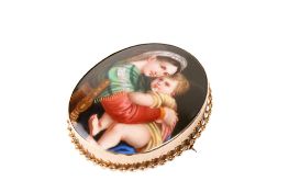 A 9ct gold mounted hand painted porcelain brooch/pendant.