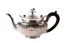 A George III silver teapot.