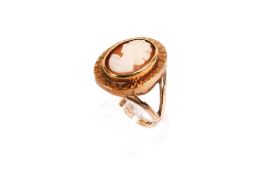 A 9ct gold cameo ring. The cameo of a female bust 1.3cm x 0.