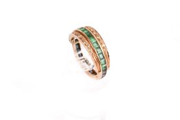 A rose coloured metal, diamond, emerald and sapphire ring.