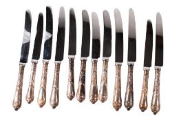 A set of twelve silver handled knives.