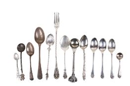 An assortment of 19th century and later silver and white metal flatware.