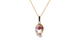A 9ct gold ruby and diamond pendant and chain.
