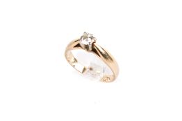 A 14ct gold (tested) diamond solitaire ring. One round brilliant cut diamond of 0.