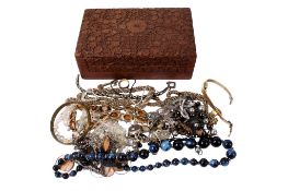 A small group of costume jewellery in a carved wood box.
