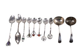 An assortment of 20th century silver and white metal spoons and ladles.