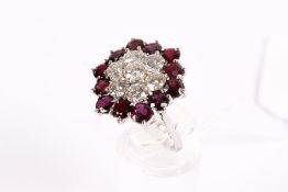 An 18ct white gold cluster ring. Set with seven round brilliant cut diamonds of 2.