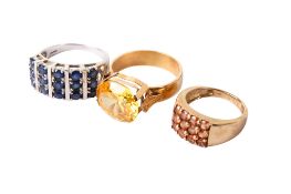 Three 9ct and yellow metal stone set rings.