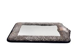 A large silver fronted dressing table mirror.